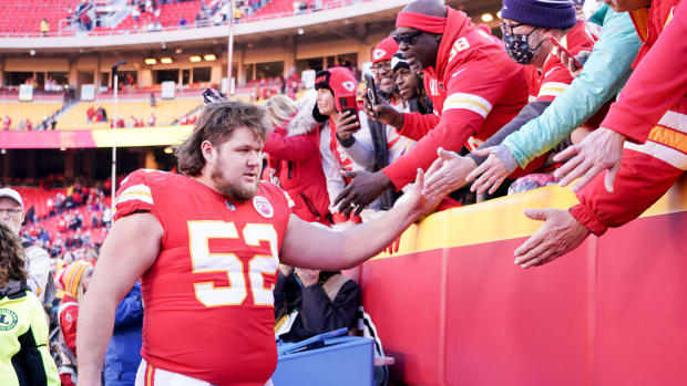 Dec 12, 2021; Kansas City, Missouri, USA; Kansas City Chiefs center Creed Humphrey (52) greets fans while leaving the field after the win over the Las Vegas Raiders at GEHA Field at Arrowhead Stadium. Mandatory Credit: Denny Medley-USA TODAY Sports